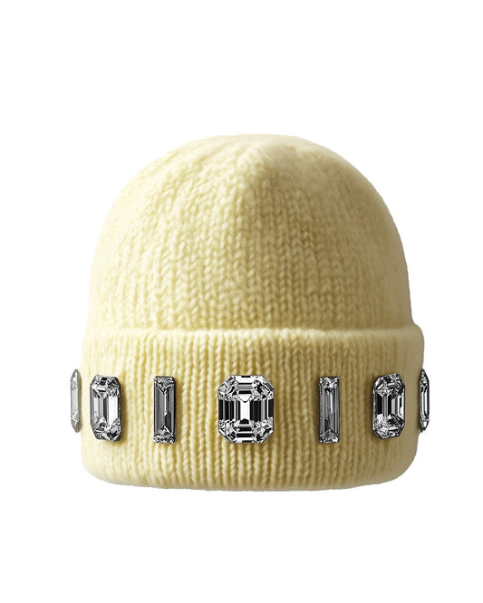 Buttercream beanie with gemstone embellishments on a white background